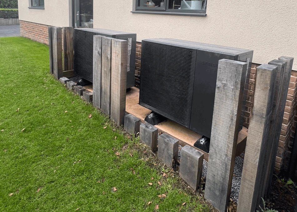 Air-source heat pumps in a landscaped garden setting