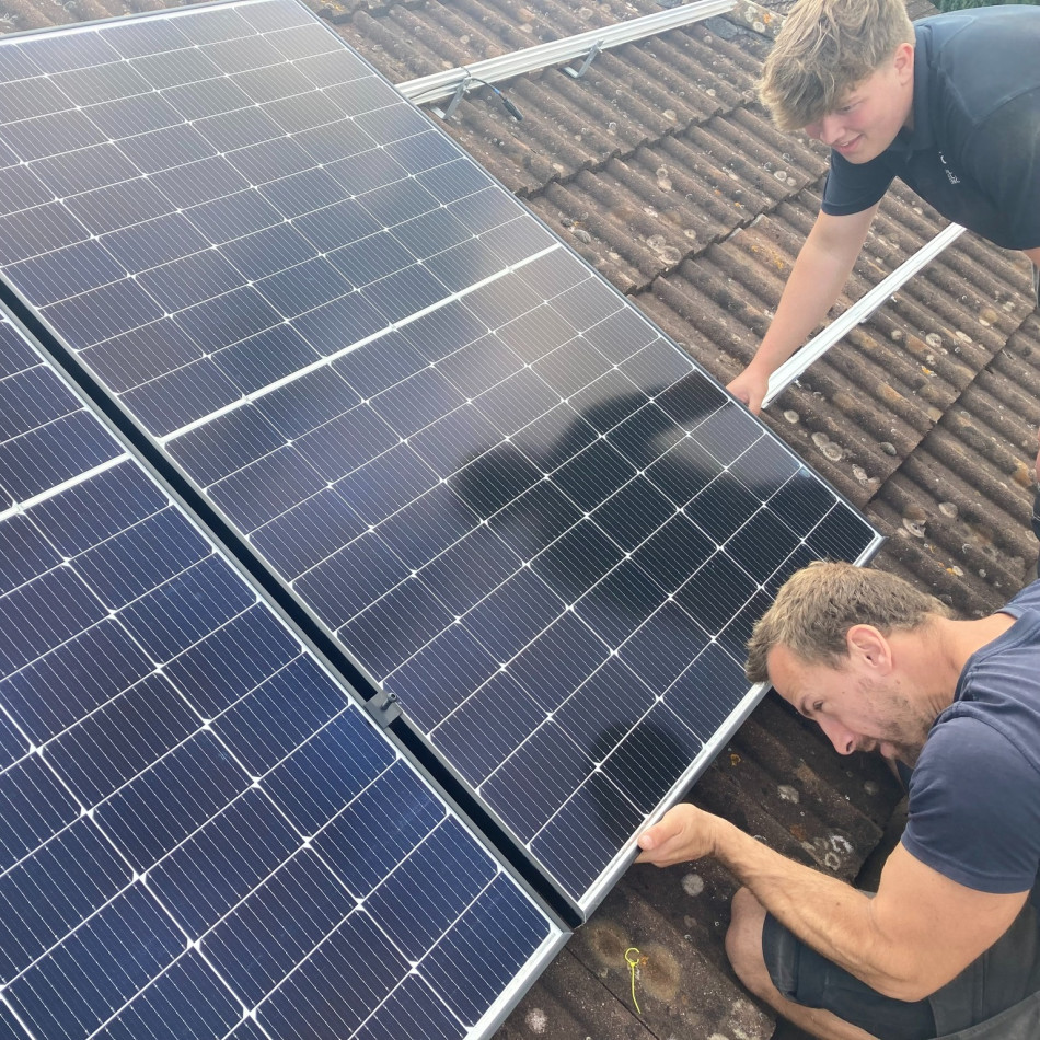 Solar Panel Installation Team Working on a Roof